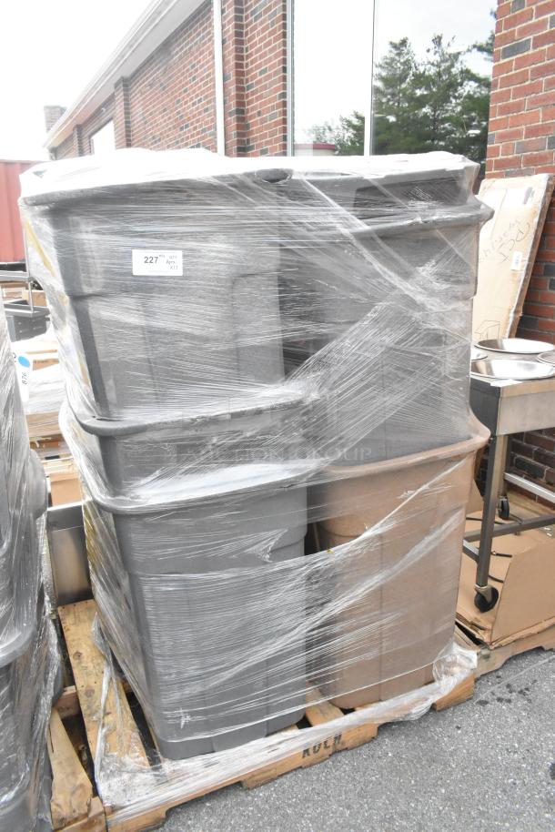 Stack of 12 poly trash cans wrapped in plastic, on a pallet. Quantity sticker indicates "227, Qty: Apr. x12".