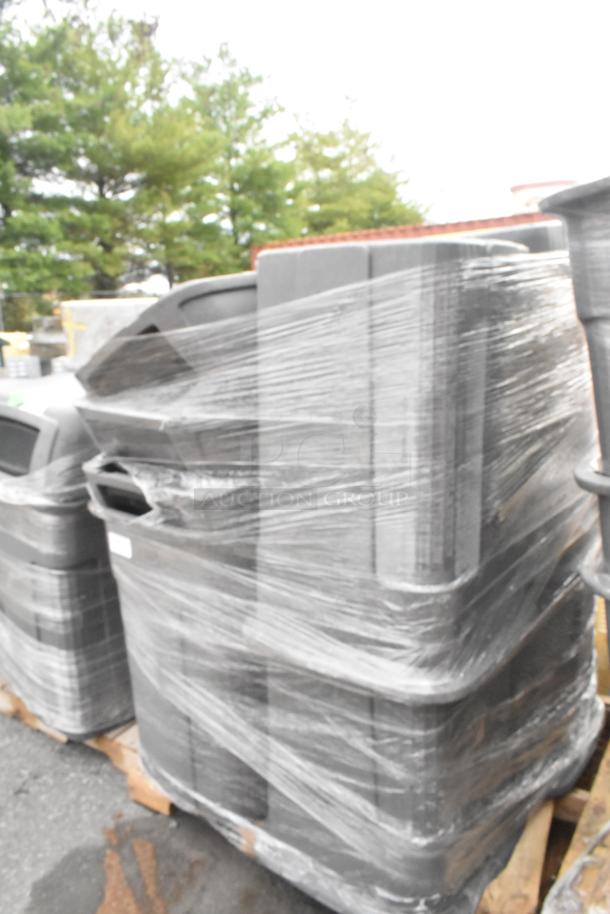 Eight poly trash cans wrapped in plastic, stacked on a pallet. Durable, outdoor-ready, perfect for bulk bidding.