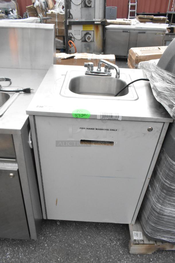 Stainless steel portable sink with faucet, single bay, on commercial casters. Label: "For hand washing only."