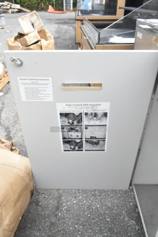 Stainless steel single bay portable sink on commercial casters, features sanitizing instructions and refill guides, strong condition.