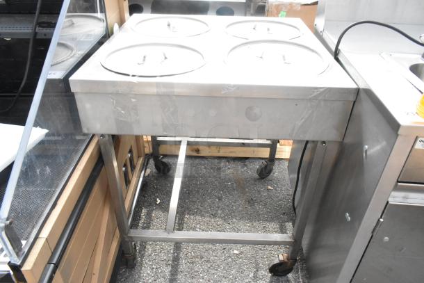 Belshaw H&I-4 stainless steel commercial heat and ice station, 208V, 1-phase, on wheels, four covered compartments.