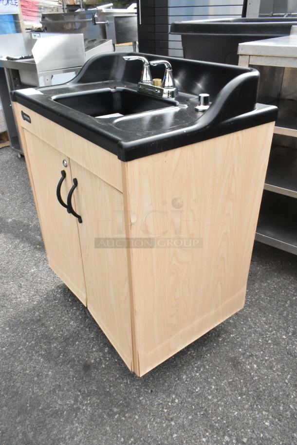 Brand new Ozark River portable hot water hand sink, model CHSTM-AB-AB1N, in laminate cabinet. Single basin, commercial casters.