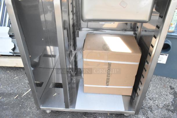 BRAND NEW Regency 600WST1524SB 24" stainless steel bussing station with pan holder and sink bowl, slight dent visible.