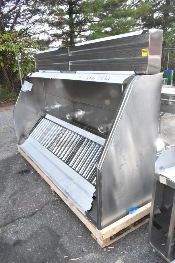 Clark stainless steel commercial grease hood with make-up air vent, brand new, visible scratches and dents, on a pallet.