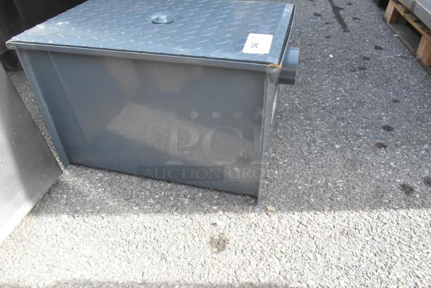 Brand new Watts WD-20 grease interceptor, 40 lb. capacity, scratch and dent condition, metal construction, visible label.