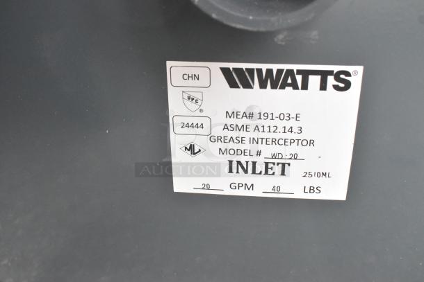 Brand new Watts WD-20 grease interceptor, 40 lb capacity, with inlet marking and model details on label; scratch and dent condition.