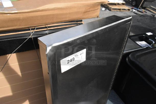 Brand new stainless steel wall mount trash and towel dispenser with visible dents, auction label showing item number 249.
