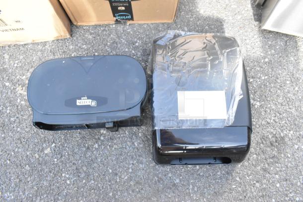 Lot of 2 wall mount black poly dispensers, brand new with minor scratches, includes Lavex Select label on one unit.