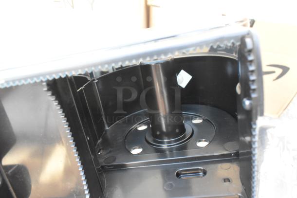 Lot of 2 wall mount black poly dispensers, brand new with scratch and dent marks. Sturdy build suitable for various settings.