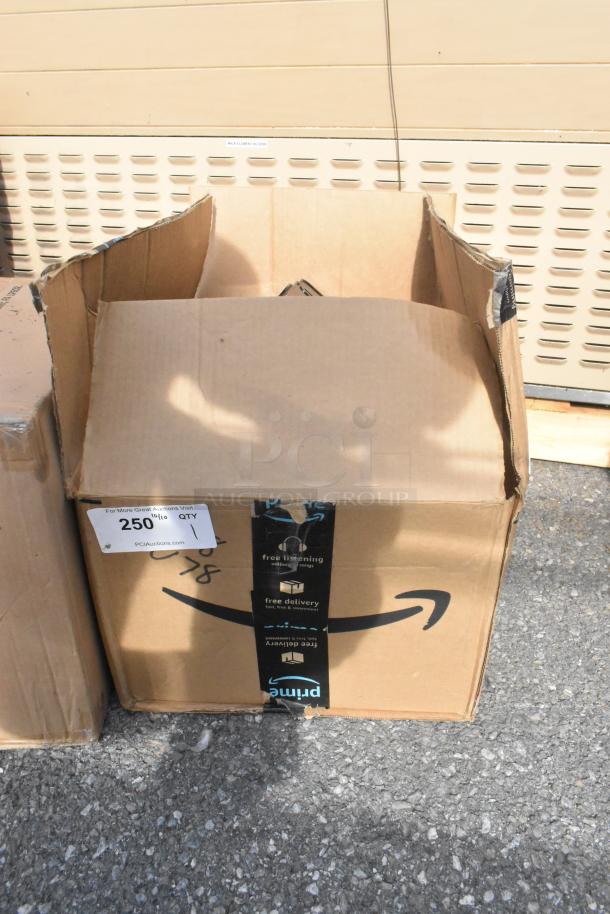 Box of 2 wall mount black poly dispensers, marked as brand new scratch and dent. Box open, slight external wear visible.