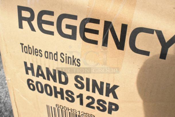 Box with "Regency Tables and Sinks, Hand Sink 600HS12SP" printed, indicating a new stainless steel single bay hand sink.