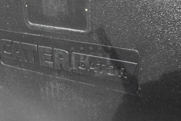 Brand new Cambro CaterGator 10-gallon black insulated beverage dispenser, visible logo, scratch and dent condition.