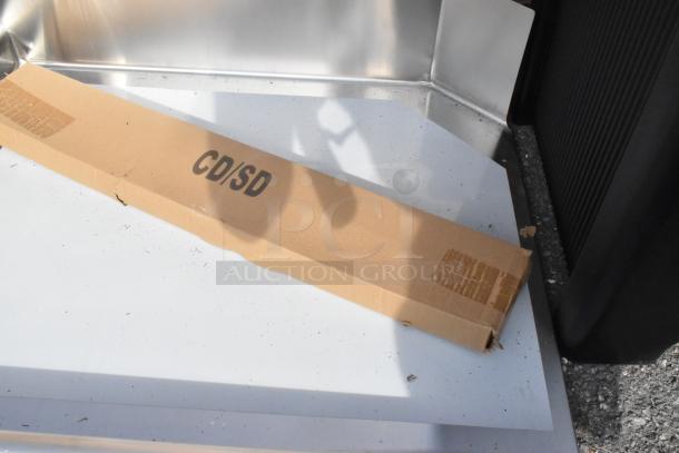 Regency 600CDT36L 16 Gauge 3' Clean Dish Table with left drainboard, new, visible scratch and dent. Box label: "CD/SD".
