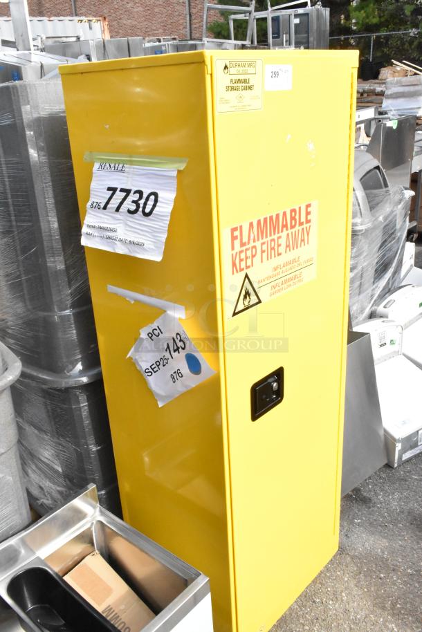 BRAND NEW 22-gallon yellow steel flammable liquids storage cabinet by Durham Mfg, model 1022M-50, with manual door; includes warning labels.