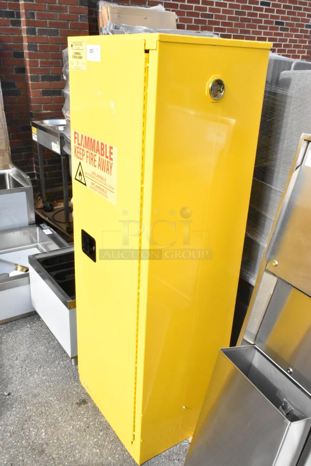 Yellow steel flammable liquids storage cabinet, Durham Mfg 1022M-50, 22-gallon capacity, with manual door, new with scratches.