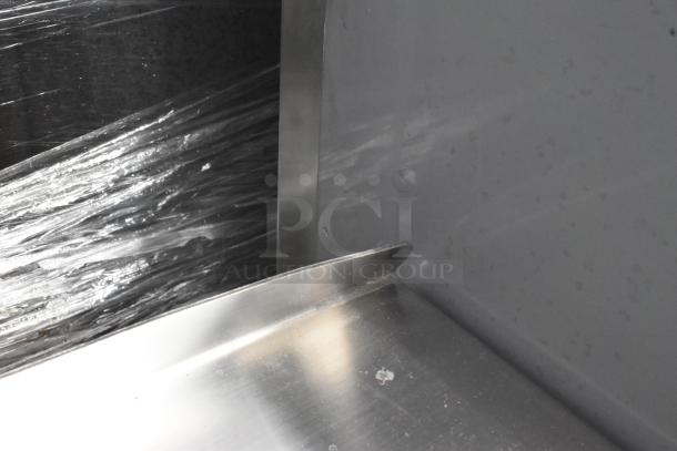 Brand new Regency 600SM20286, 33" 16-gauge stainless steel mop sink with minor scratches; 28"x20"x6" bowl.