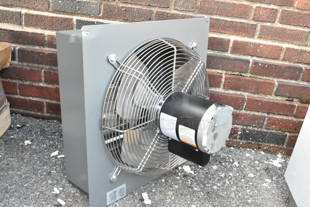 2025 Canarm S16-E1 metal wall exhaust fan, brand new with visible dents. Silver blades, black motor. Model label visible.