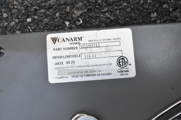 2025 Canarm S16-E1 Metal Wall Exhaust Fan with minor scratches and dents. Label shows part number SD160311. New condition.