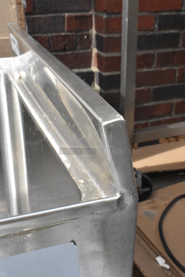 Brand new Regency 600BB2424 24" x 24" stainless steel beer box with 3" backsplash, minor scratches, no legs included.