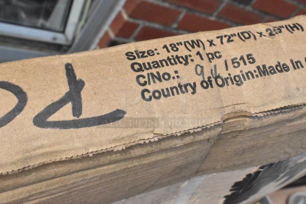 Brand new 18"x72" Lancaster folding table in original box, noted as scratch and dent, with visible package details.
