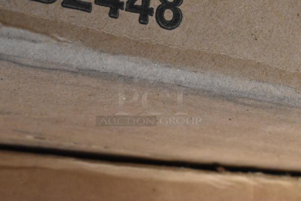 Close-up of a cardboard box edge with printed numbers "2448." The box contains new, scratch and dent items.