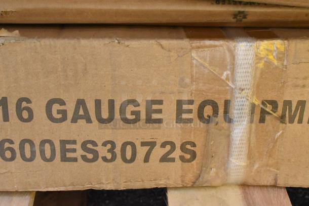 Cardboard box labeled "16 Gauge EQ" and "600ES3072S" showing signs of wear with tape and edge damage.