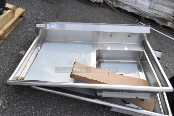 Brand new Regency 50" 16-gauge stainless steel dishtable, sink on right, minor scratches, model 600UDT50R.