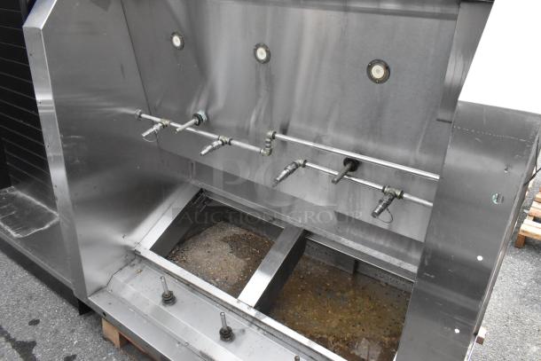5' Wells stainless steel self-contained grease hood with integrated lights, in good condition, showing control knobs and ventilation system.