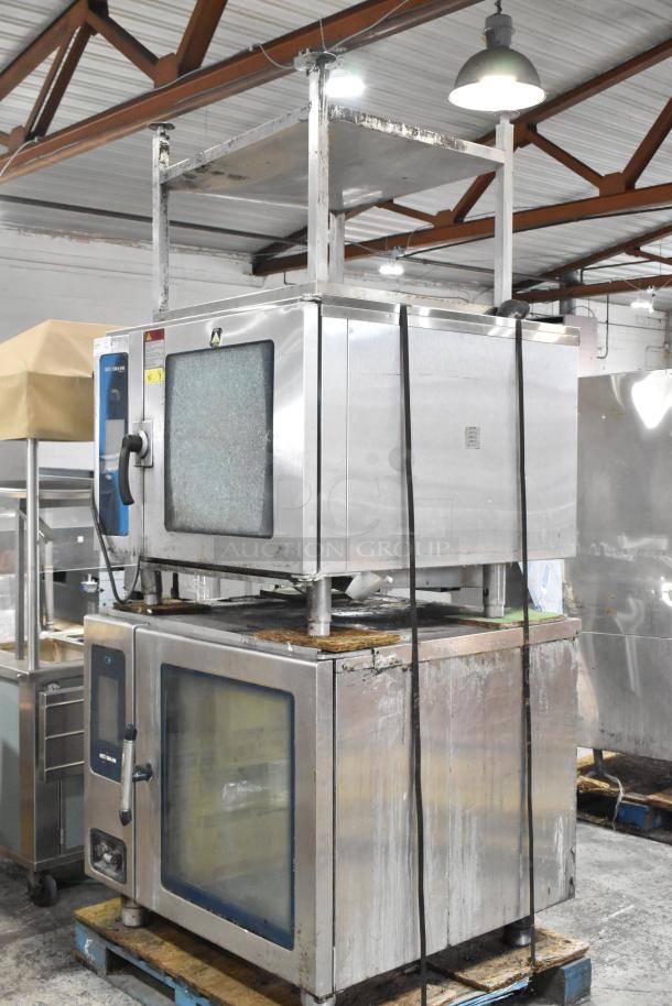 Two Alto Shaam stainless steel combi convection ovens with equipment stand. Model CTP10-10E; 208/240V, 3 phase. Upper oven has broken glass.