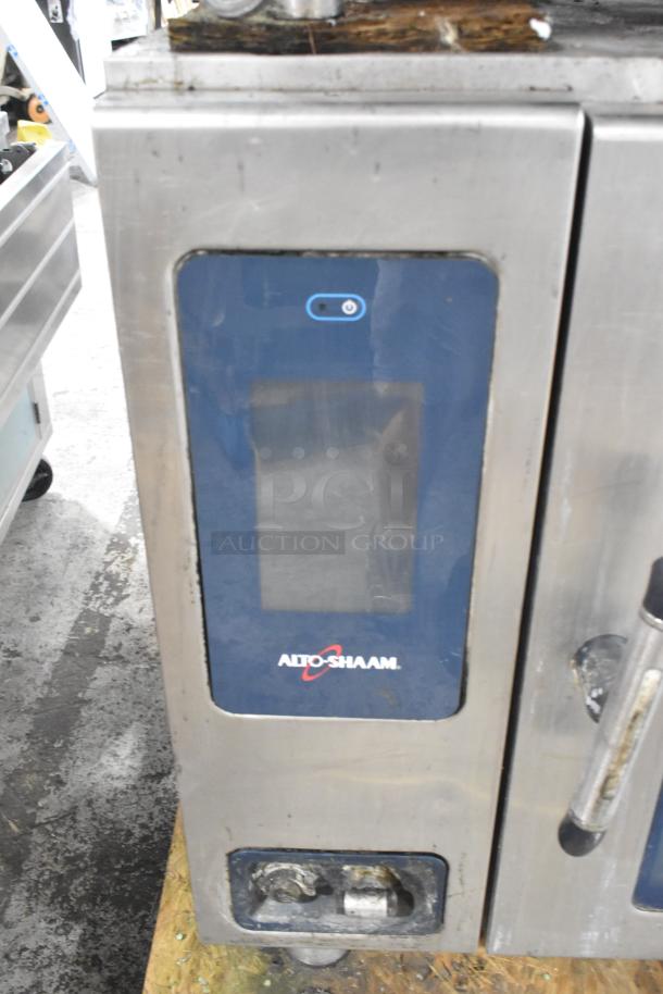Alto Shaam stainless steel commercial electric combi convection oven, Model CTP10-10E, with visible broken glass.