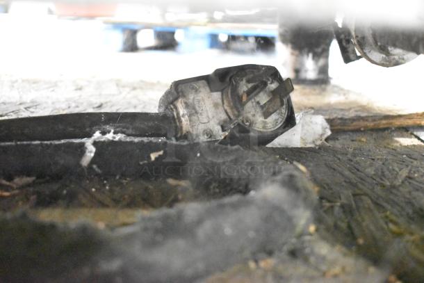 Close-up of a damaged power plug attached to an electrical cable, related to Alto Shaam combi convection ovens.