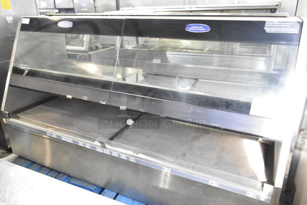 Metal commercial floor merchandiser with glass front, shelves, price tags, and caution hot label; used condition.
