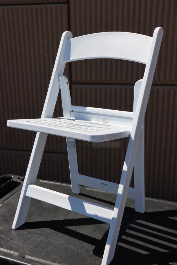 BRAND NEW Lancaster Table & Seating white resin folding chair with slatted seat, model 427FCRSLTWHT, potential minor scratches.