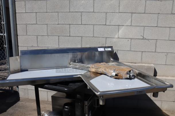 Brand new Regency 600CDTI48R 4' L-shape dishtable, 16-gauge stainless steel, dented right island edge, includes legs.