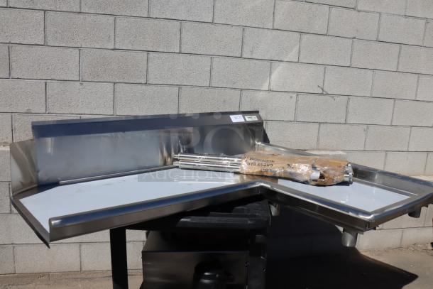 Regency 600CDTI48R 4' stainless steel L-shape dishtable, right island, 16-gauge, includes legs, dented edge, damaged packaging.