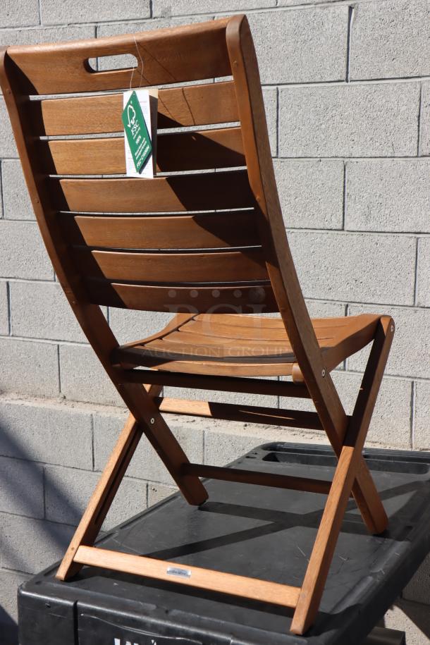 Outdoor Interiors #10050 eucalyptus folding armless chair, brand new scratch-n-dent, FSC tag, sturdy wood slat design.