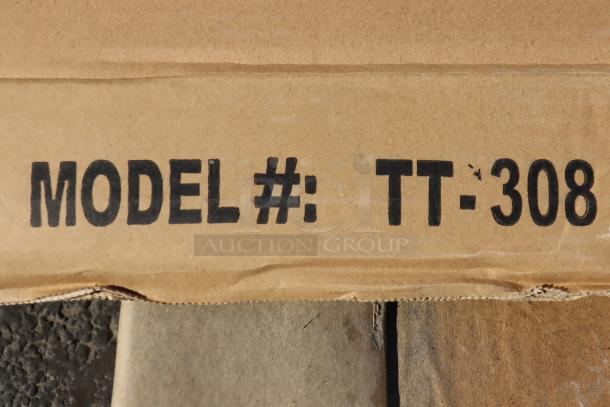 Alt text: "Model number TT-308 marked on cardboard for Advance Tabco stainless steel work table."