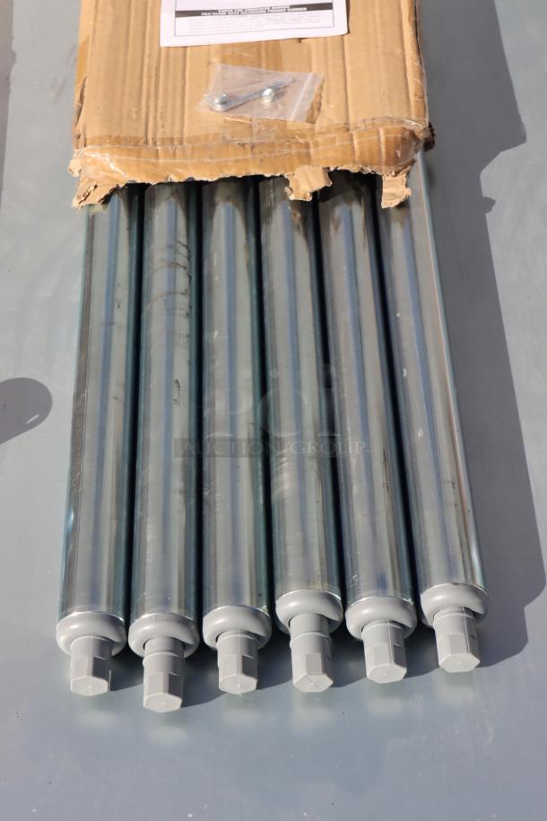 Advance Tabco TT-308-X work table parts, showing six metal legs with caps, partially unpacked from a cardboard box.