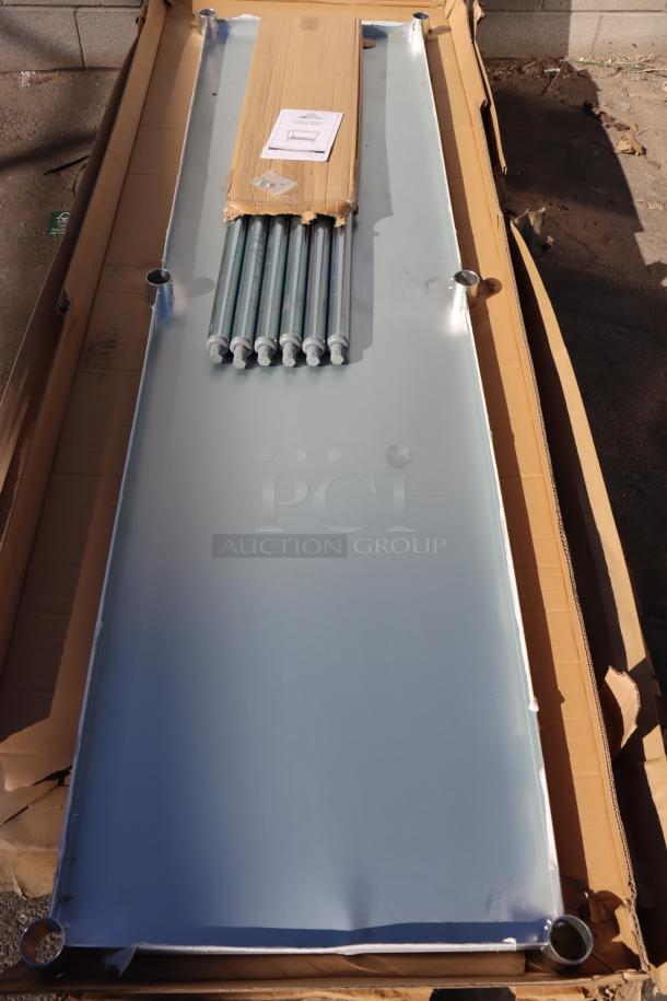 Advance Tabco TT-308-X 30"x96" stainless steel work table, out of original packaging, with visible poles and manual.