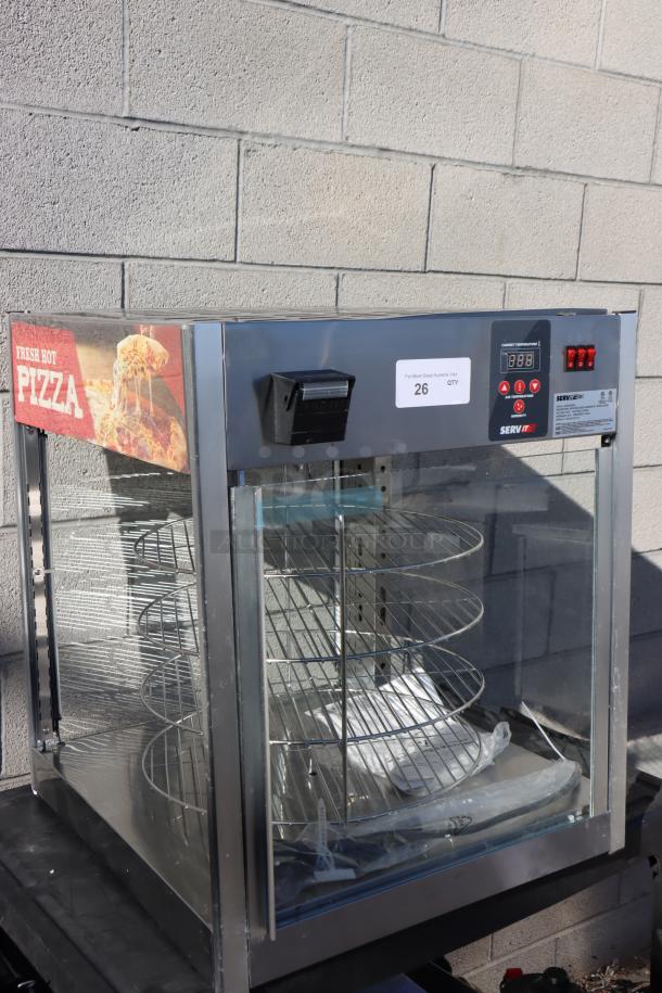 Brand new ServIt PDW18D1 pizza warmer, 18", full-service, 4-shelf rotating rack, missing glass pane, slight imperfections.