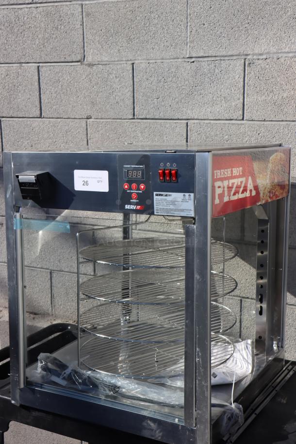 Brand new ServIt PDW18D1 18" pizza warmer with 4-shelf rotating rack. Missing glass pane; may have small missing pieces.