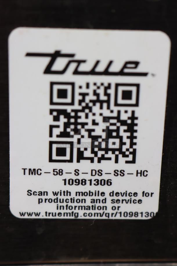 QR code label on True TMC-58-S-DS-SS-HC milk cooler, includes model number and service information.