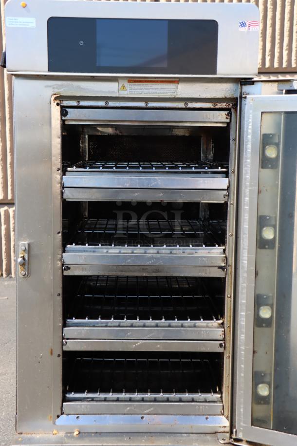 Alto-Shaam VMC-H4H multi-cook oven, stainless steel, tested, in perfect working order, open door showing four cooking chambers.