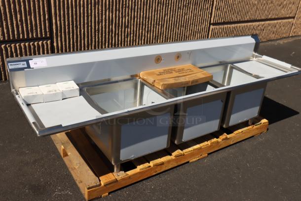 Regency 600S31818218 stainless steel sink, three compartments, cross bracing, minor scratches, bent backsplash corner. Brand new.