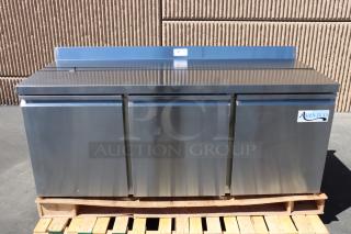 Brand new Avantco SS-WT-72R-HC 72" three-door worktop refrigerator, minor front right wheel damage, working condition.