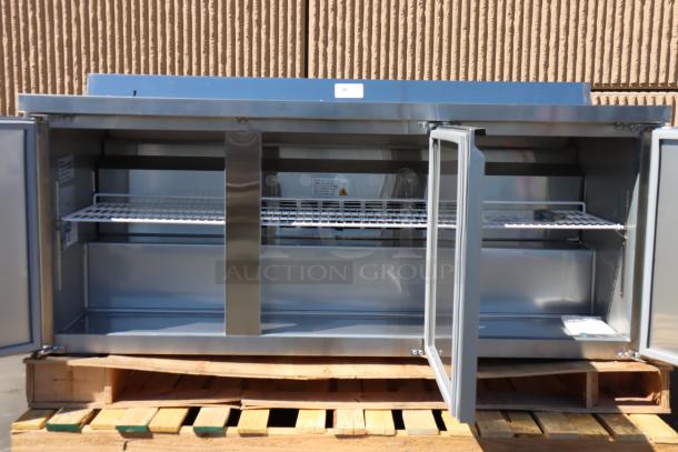 Brand new Avantco 72" three-door worktop refrigerator with backsplash on wooden pallet; front right wheel damaged.