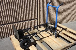 Brand new Harper DTC8635P 4-in-1 hand truck, dual handles, 10" solid rubber wheels, 900 lb. capacity, on wooden pallet.