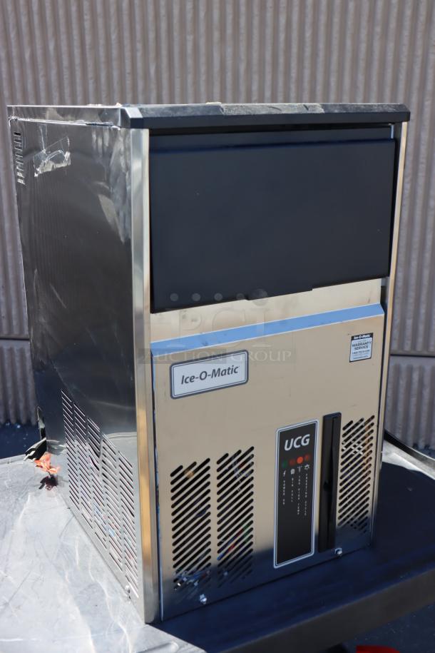Brand new Ice-O-Matic UCG060A 15" air-cooled ice machine, 115V, out of packaging, minor exterior dents, may be missing small parts.