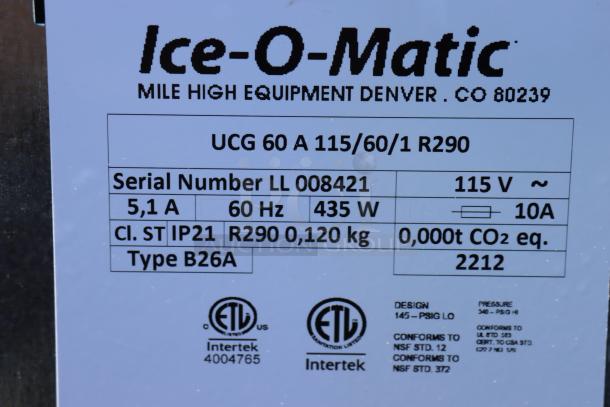 Ice-O-Matic UCG060A air-cooled ice machine label. Serial LL 008421, 115V, 60Hz, 435W, conforms to NSF standards.