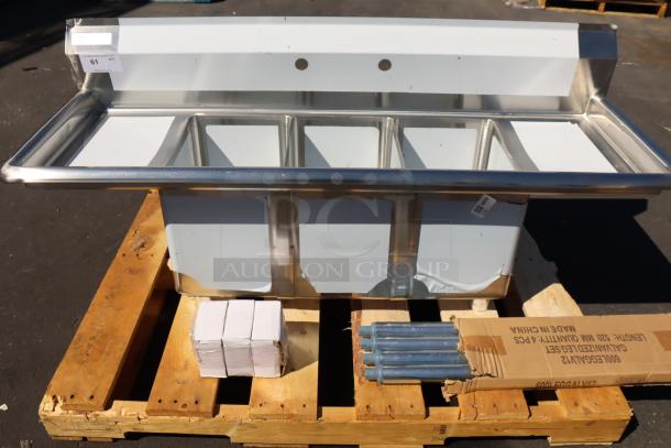 Steelton 54" stainless steel 3-compartment sink, model 522CS31014LR, brand new with minor scratches and dents, visible on pallet.